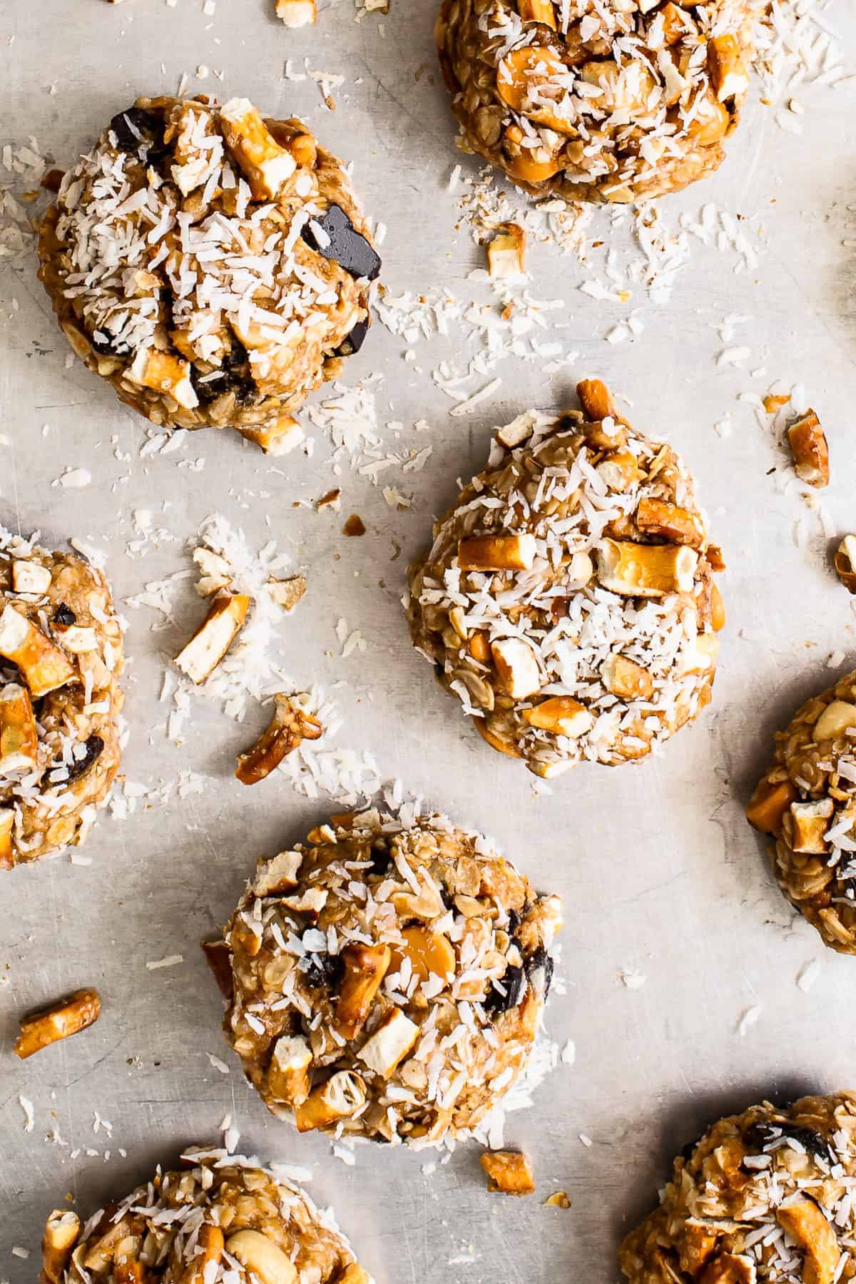 kitchen sink cookies on a baking sheet topped with coconut