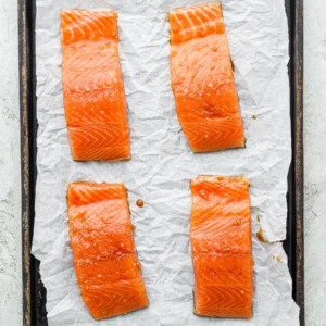 Salmon fillets on a baking sheet.