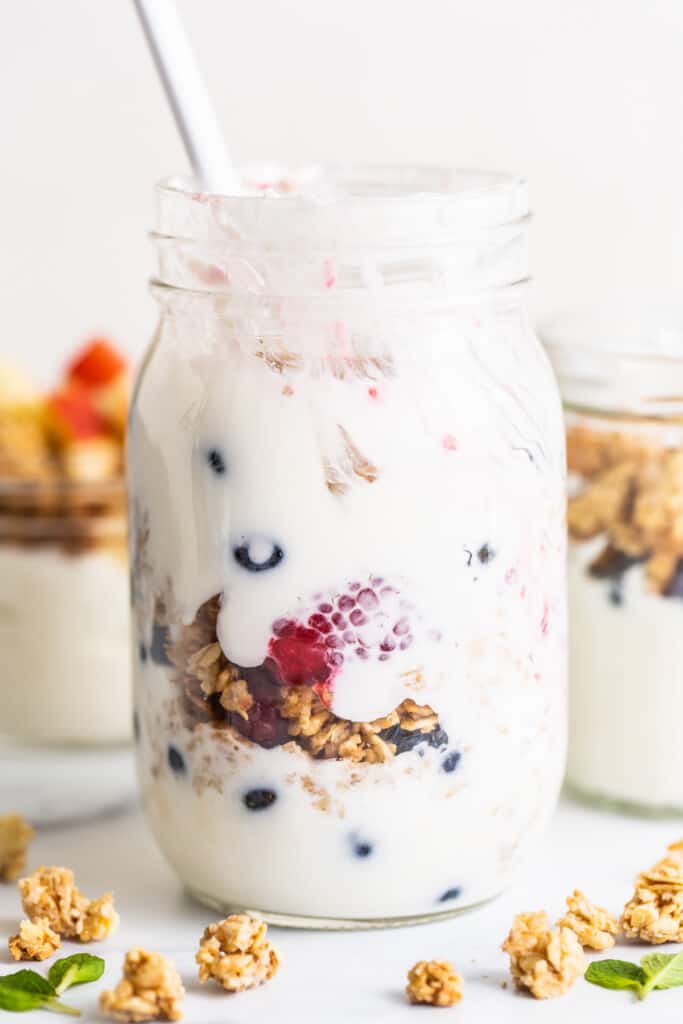 yogurt parfait in a mason jar with berries