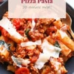 Bowl dish with sausage, pizza, and pasta.