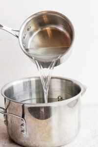 Pouring water into turkey brine.