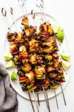 Make the most juicy rainbow grilled chicken kabobs! These are the BEST grilled chicken kabobs thanks to our amazing marinade. Grilled chicken kabobs on a plate.