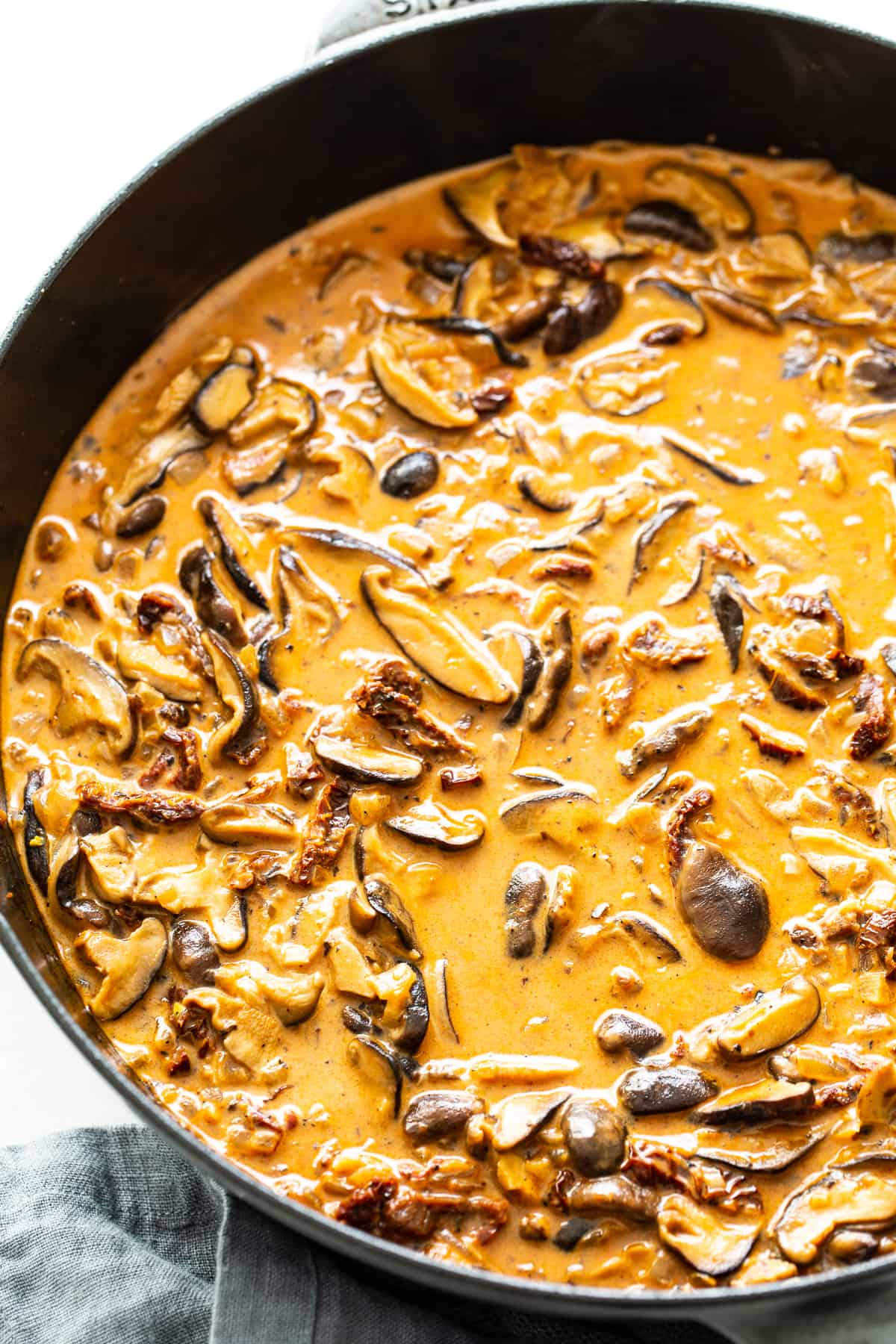 chicken mushroom pasta sauce in a pan. 