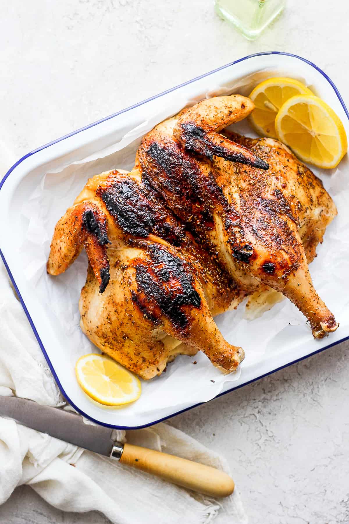 spatchcock chicken on platter.