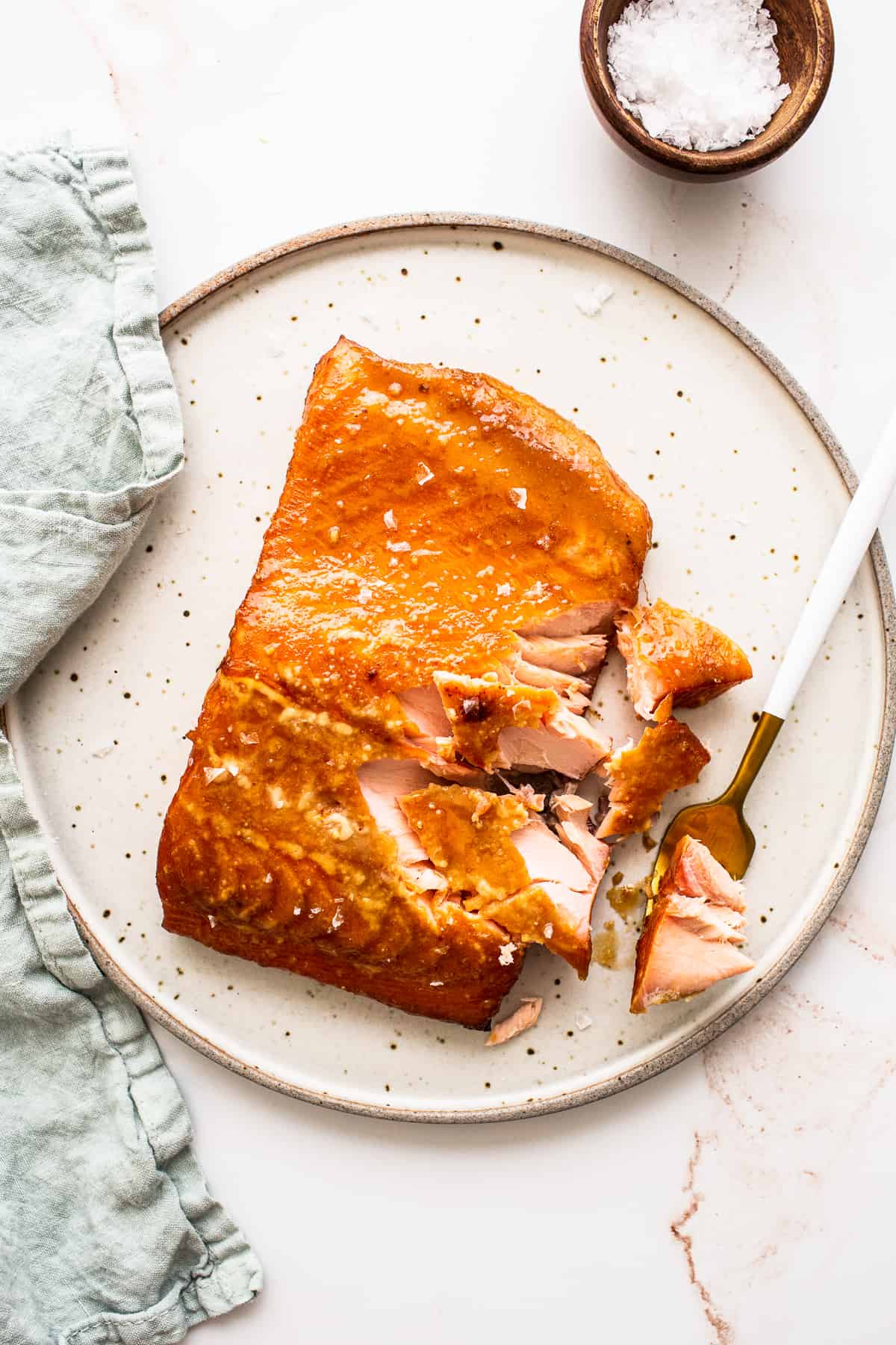 Smoked salmon on a plate with a fork. 