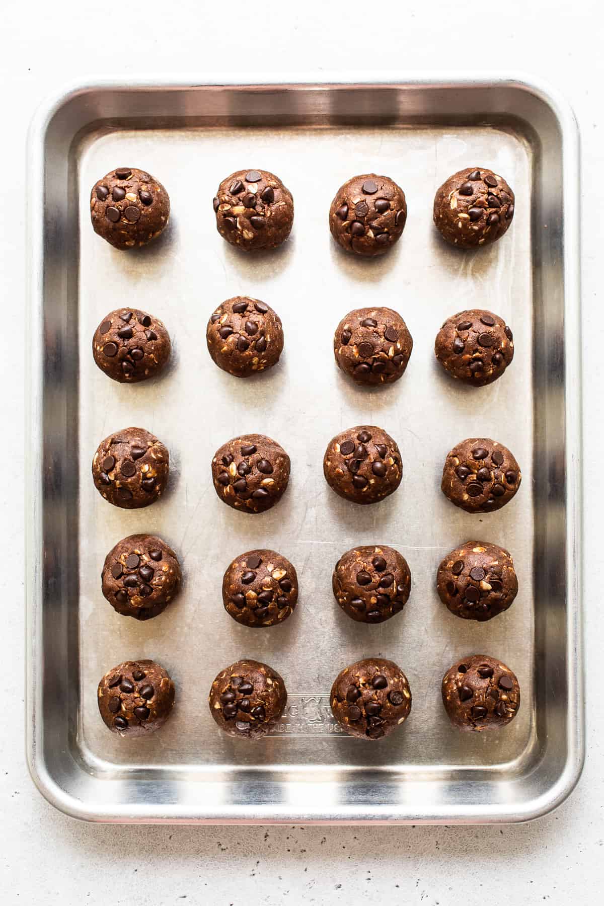 protein balls on baking sheet.