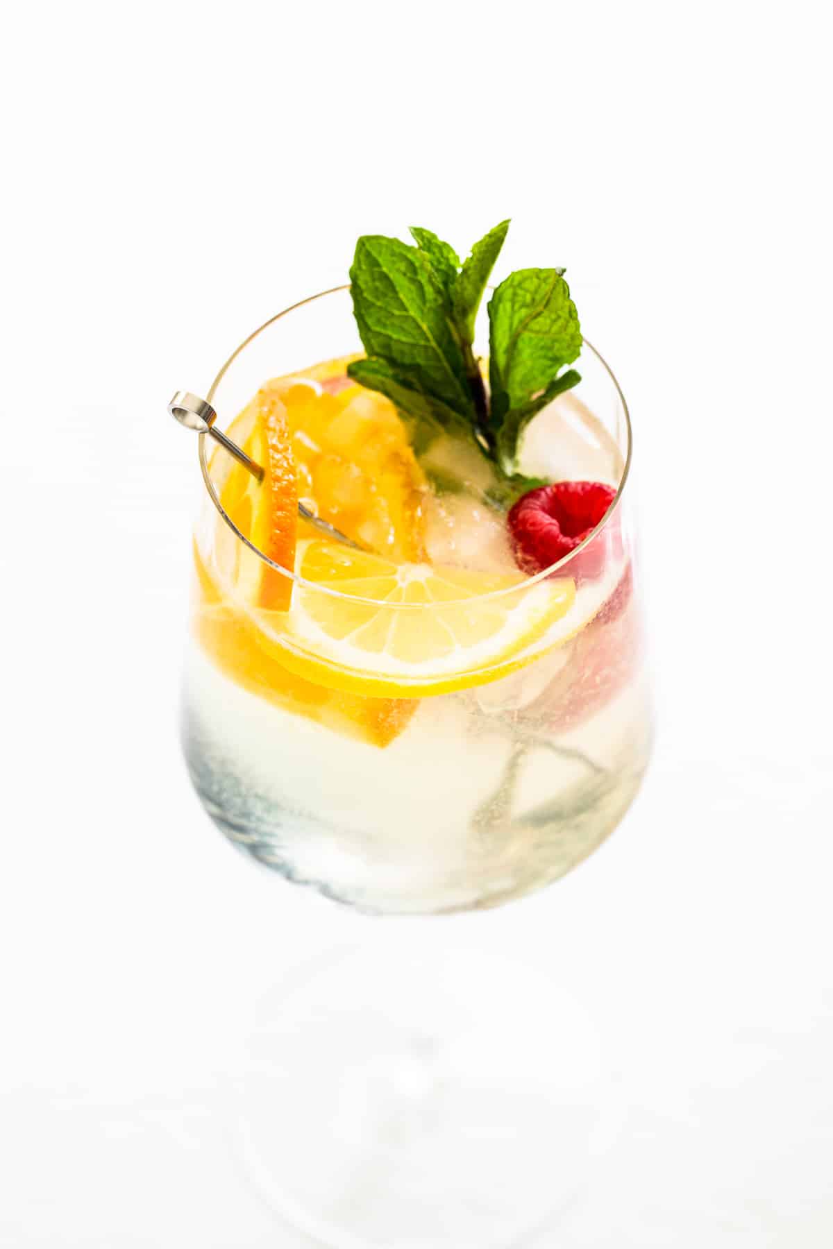 White wine spritzer in a glass with fresh mint. 