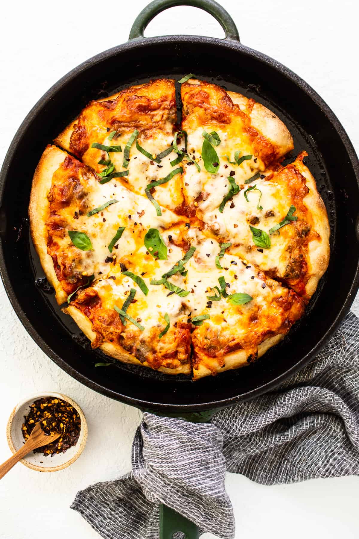 cast iron pizza with basil.