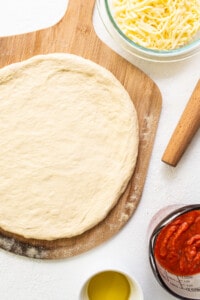 rolled out pizza dough.