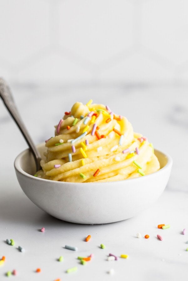 A bowl of dole whip with sprinkles in it.