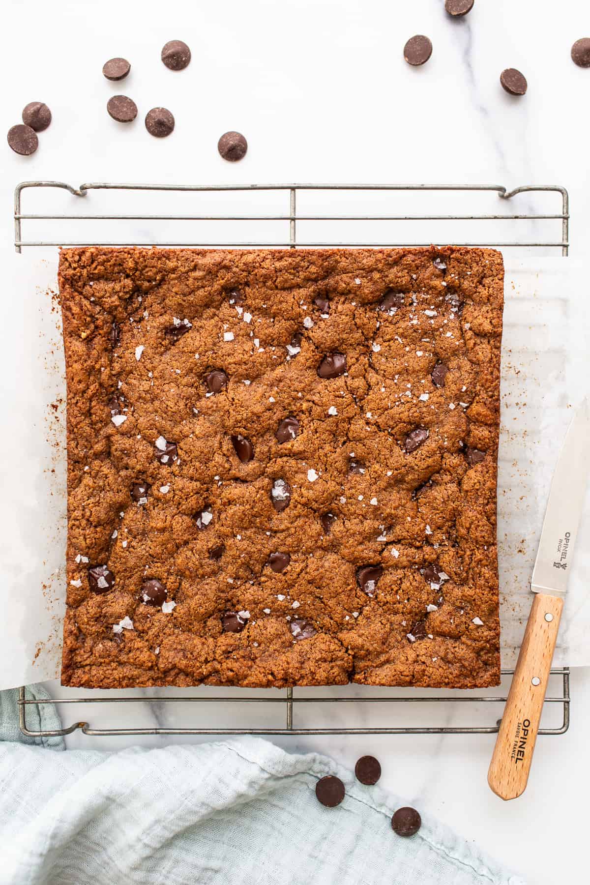 unsliced cookie bars on drying rack.