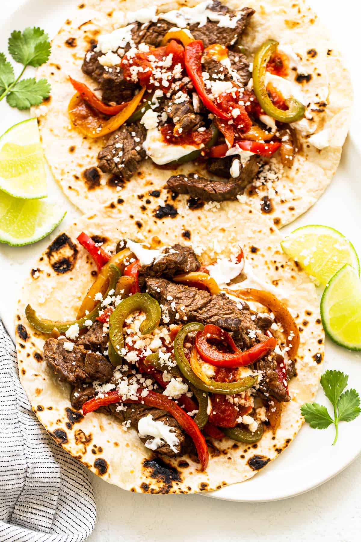 Steak fajitas on a tortilla.