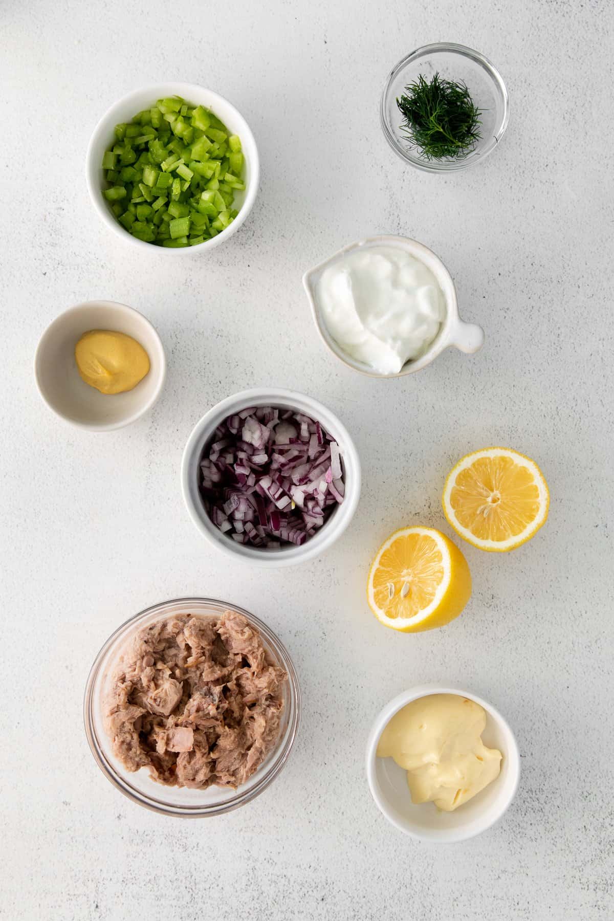 Ingredients for tuna salad in bowls.