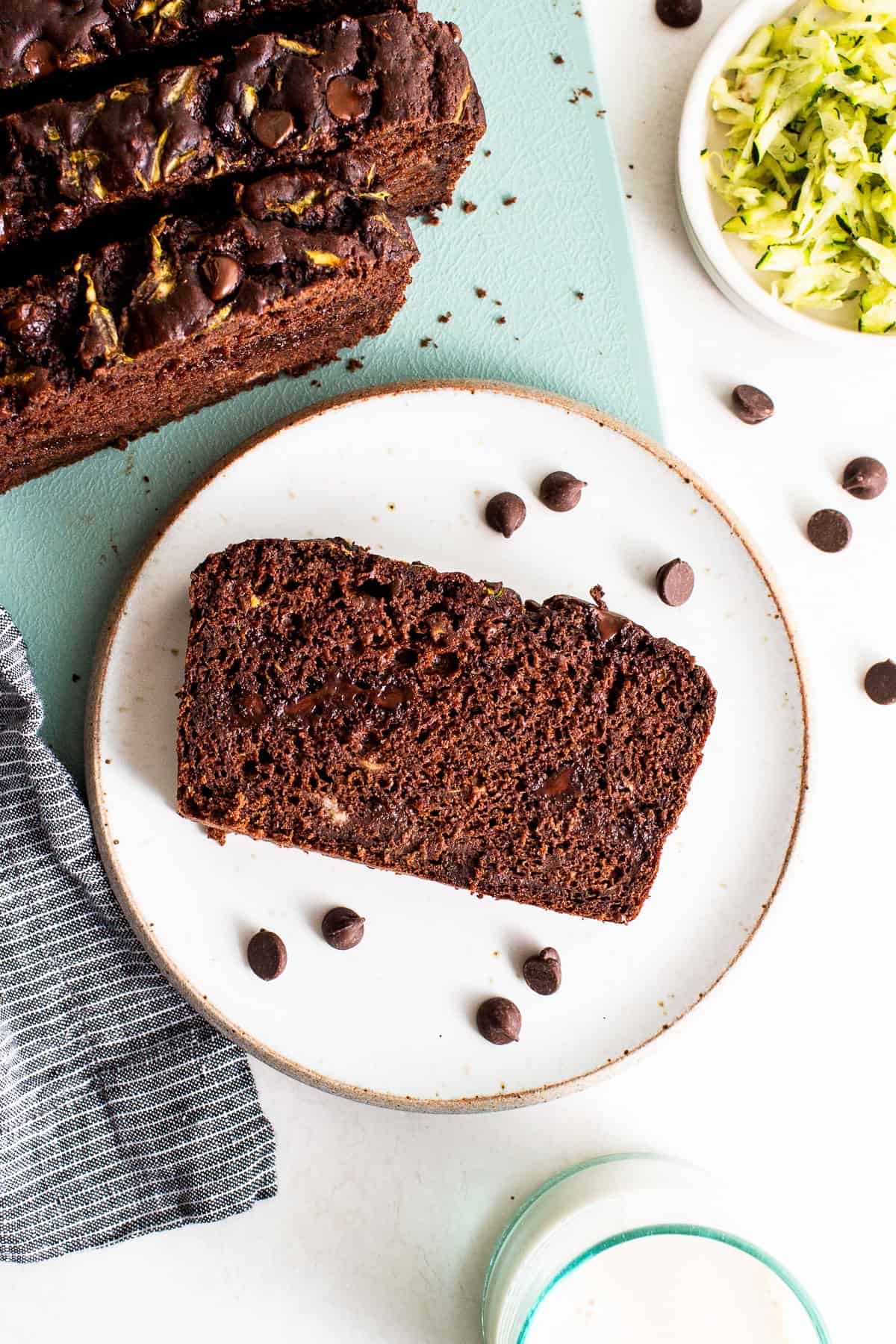Slice of chocolate zucchini bread on a plate.