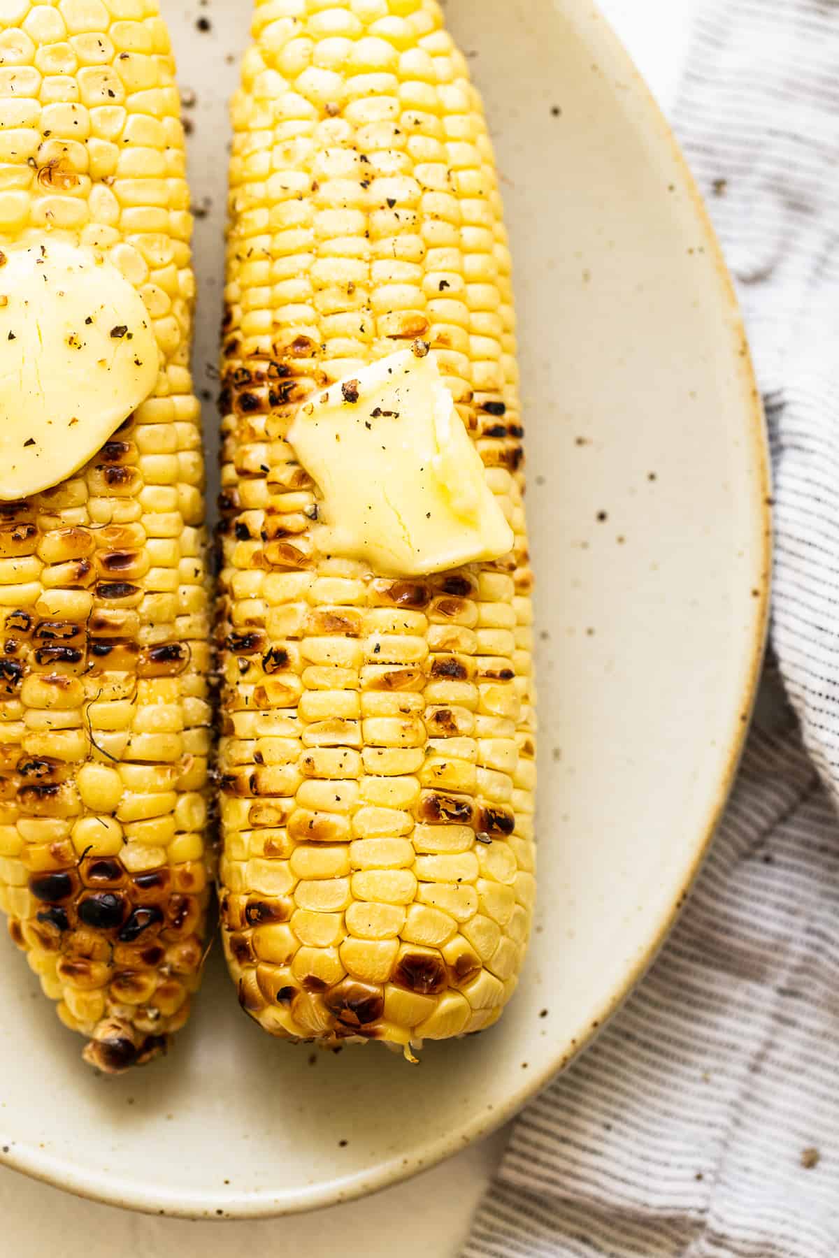grilled corn on the cob with butter and salt.