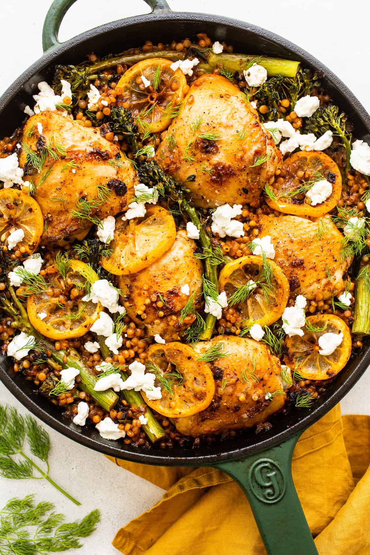 Lemon chicken skillet topped with goat cheese.