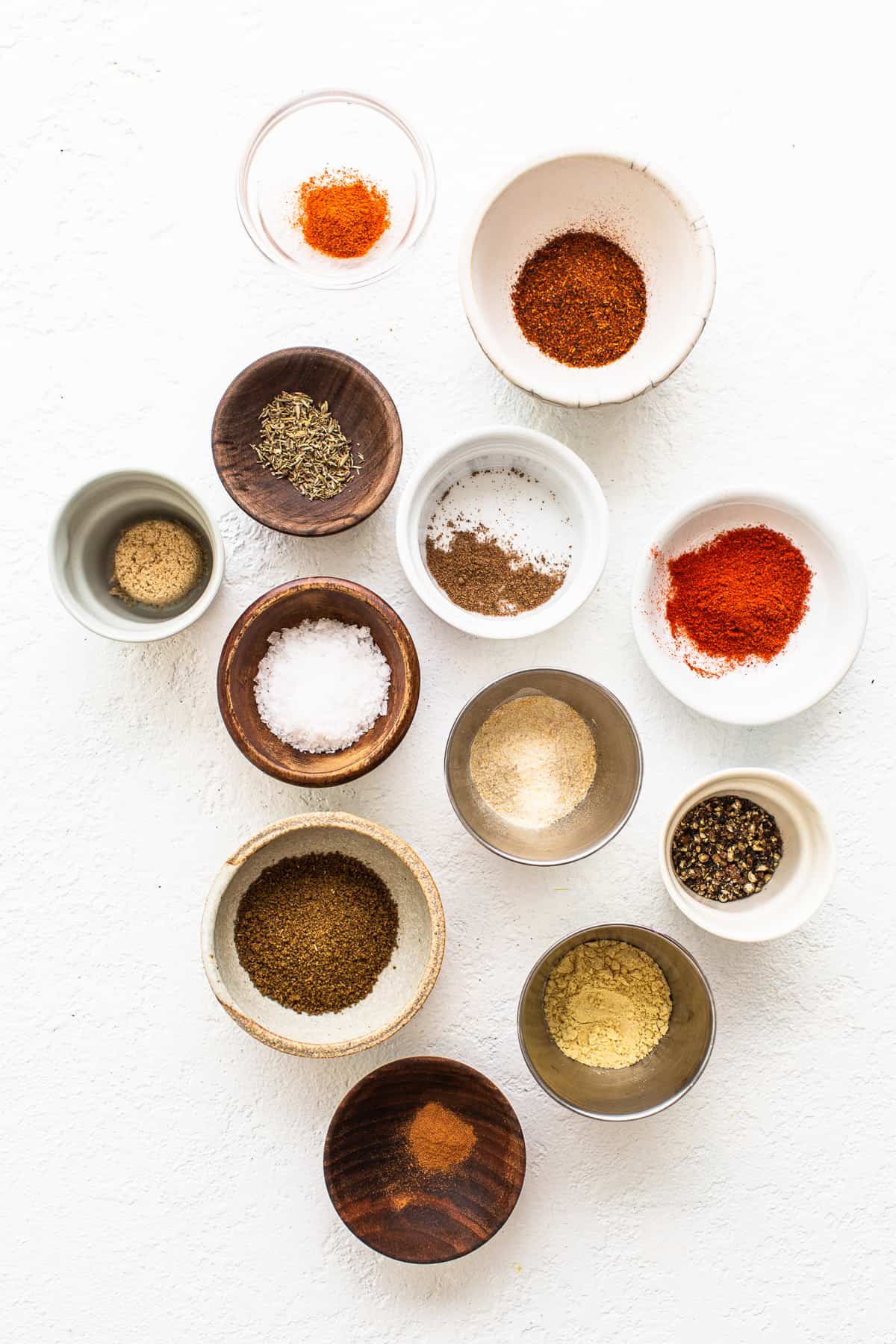 different spices in small bowls.
