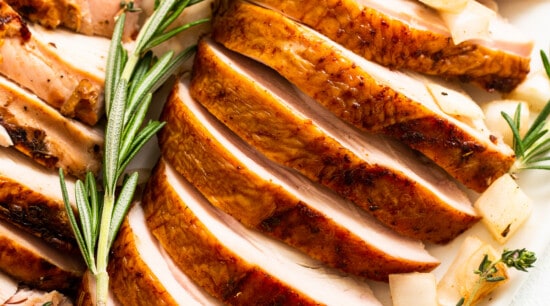 Smoked turkey breast sliced on a plate.