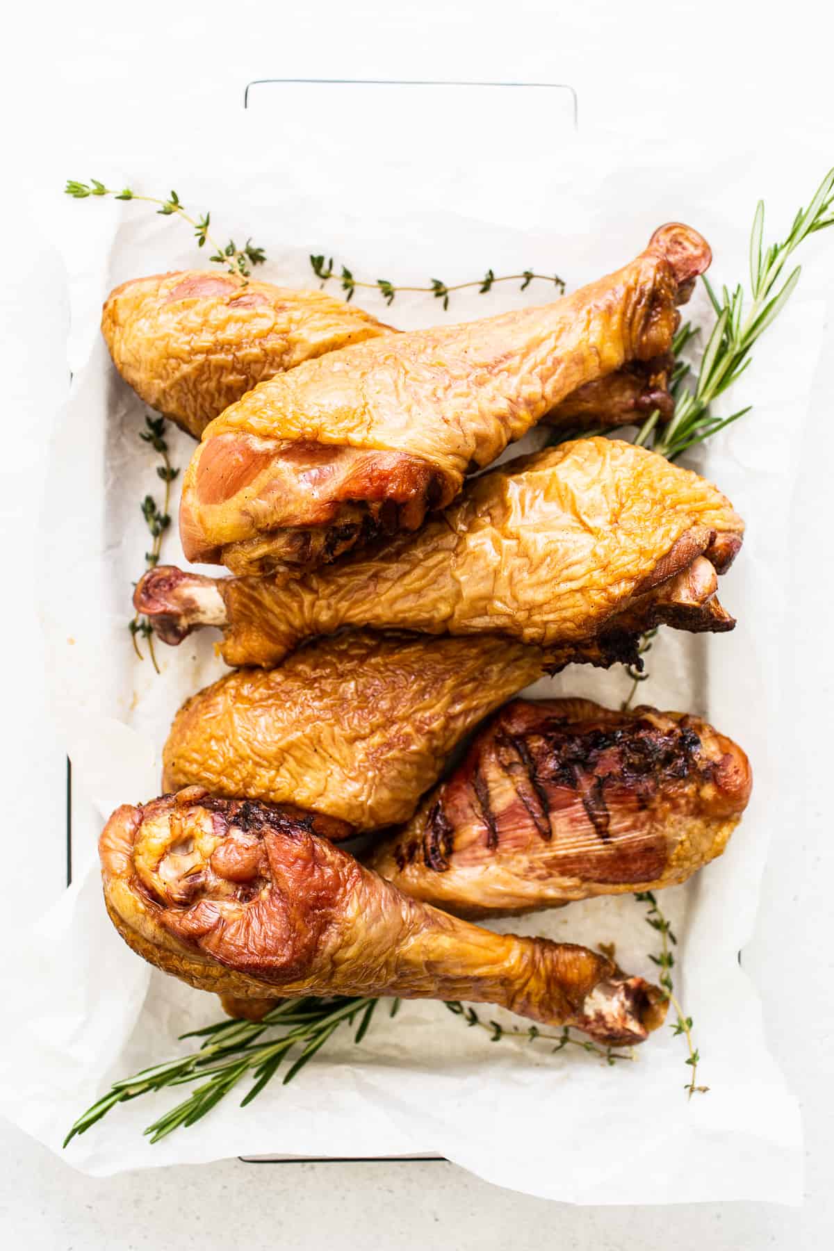 Smoked turkey legs on a platter. 