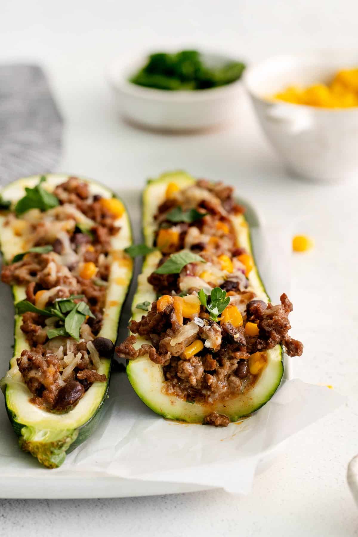 ground beef stuffed zucchini on plate.