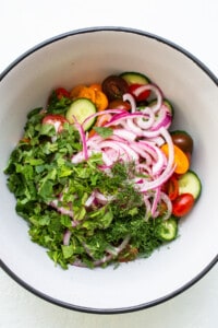 Add fresh mint and onions to tomatoes.