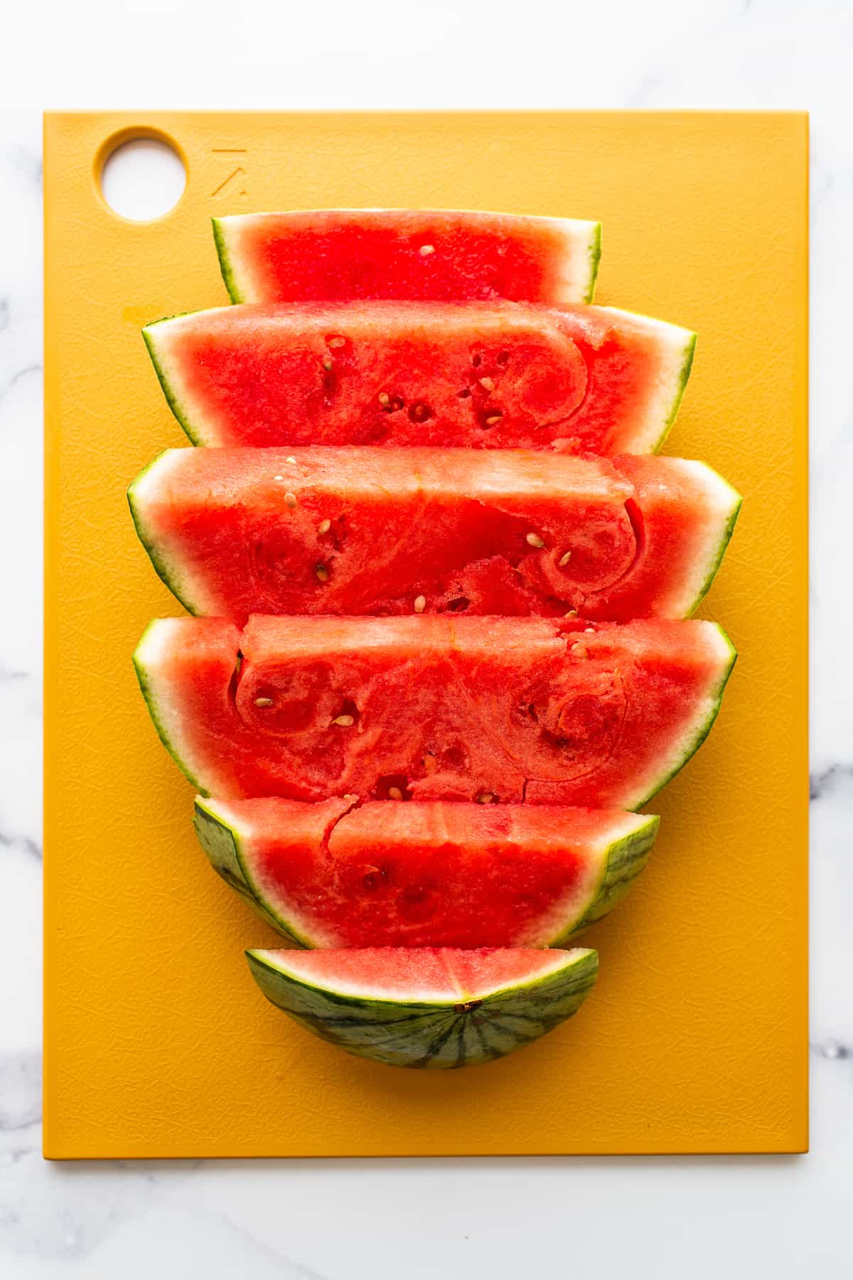 sliced ​​watermelon on cutting board