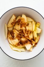 Apples and spices in a bowl.