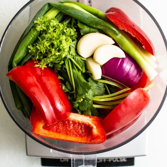 Fresh vegetables in a food processor.