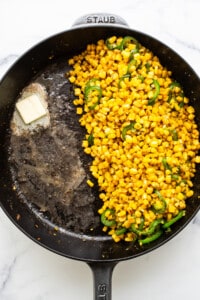 Corn in a frying pan with butter.