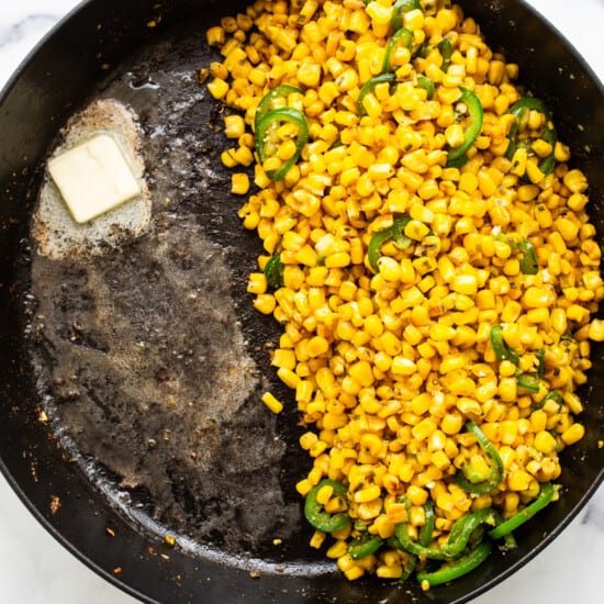 Corn in a frying pan with butter.