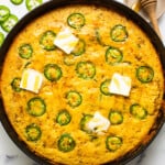 Jalapeno corn pudding in a cast iron skillet.