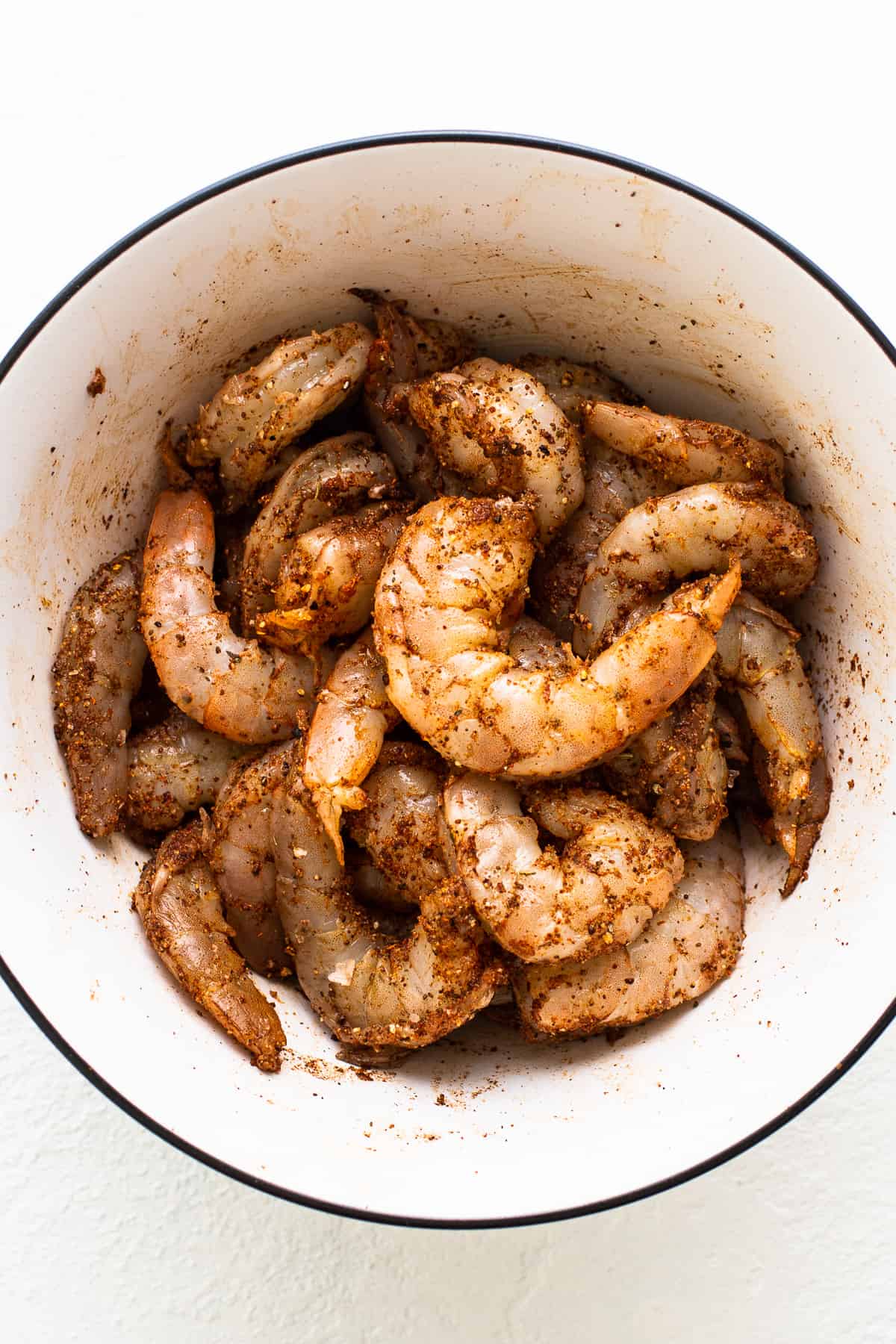 Shrimp sitting in old bay seasoning.