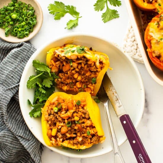 Mexican stuffed peppers on a white plate.