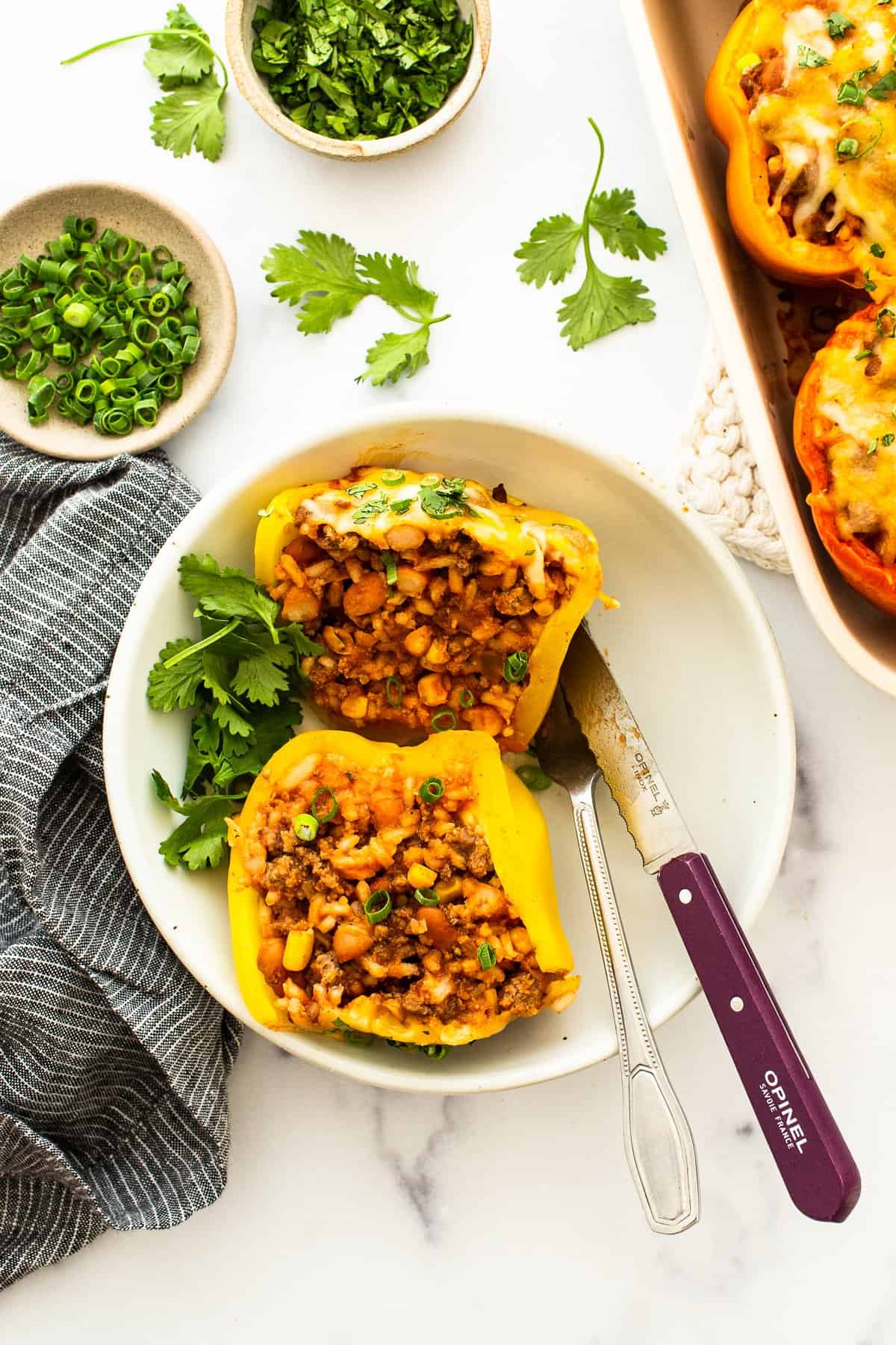 Stuffed pepper cut in half on a plate.