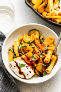 Summer squash pasta with burrata cheese and balsamic glaze on top.