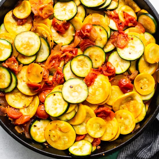 Zucchini and yellow squash in a skillet.