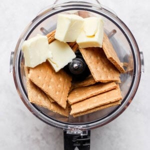 butter and crackers in food processor.