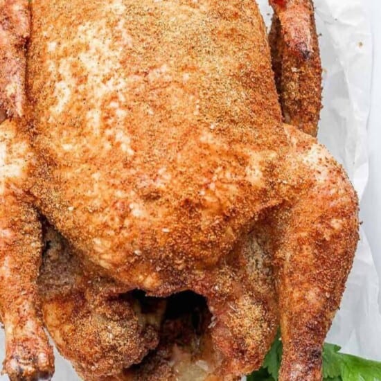 whole chicken in pan.