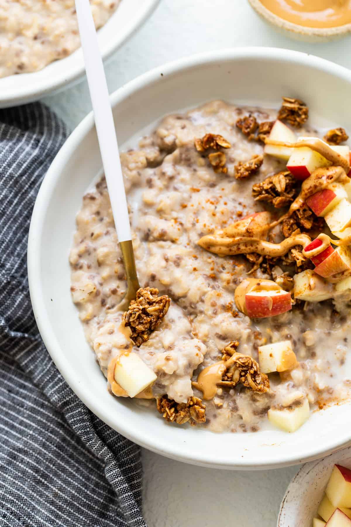 Apple cinnamon oatmeal topped with granola.