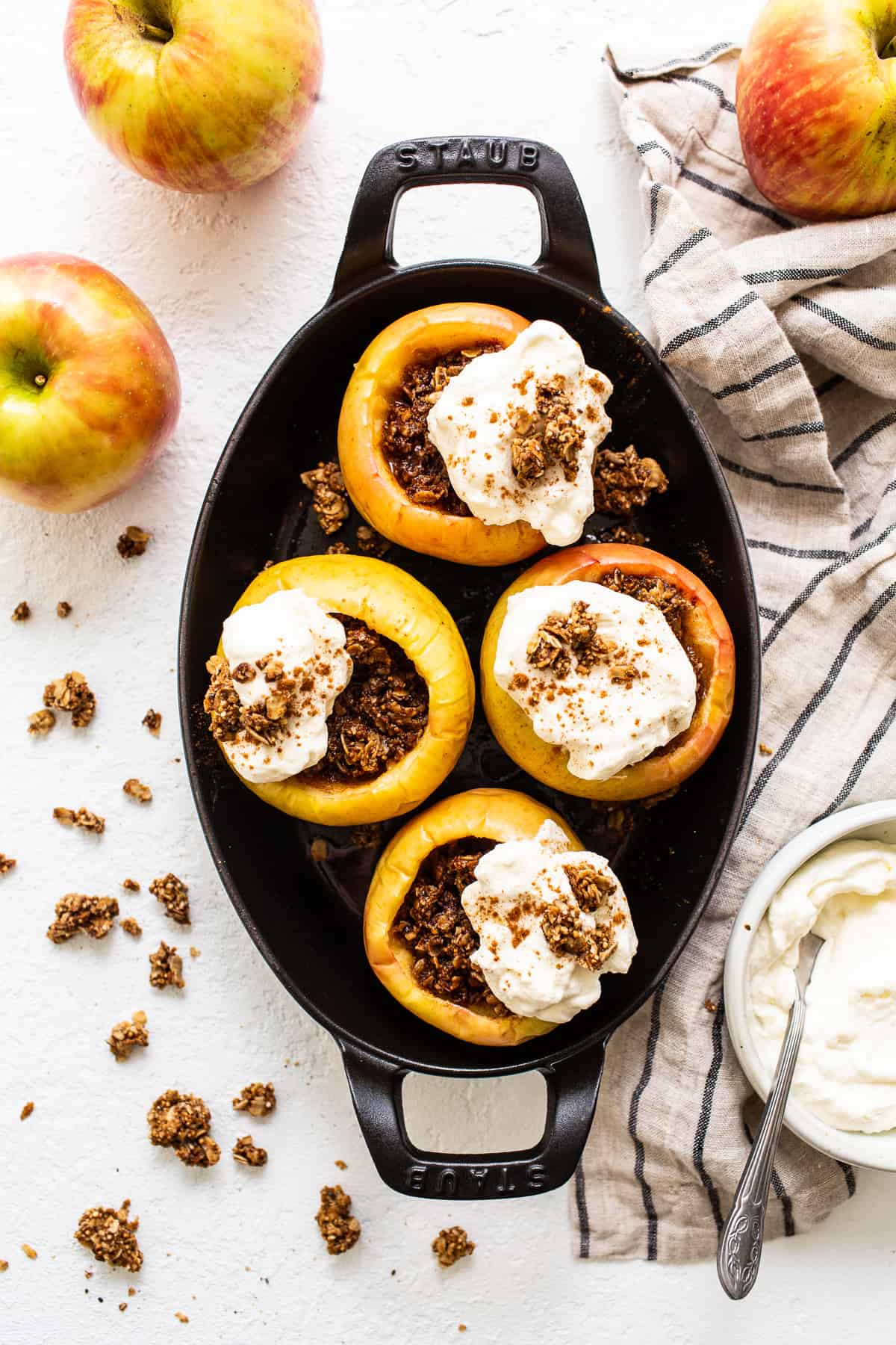 Baked apples topped with whipped cream.