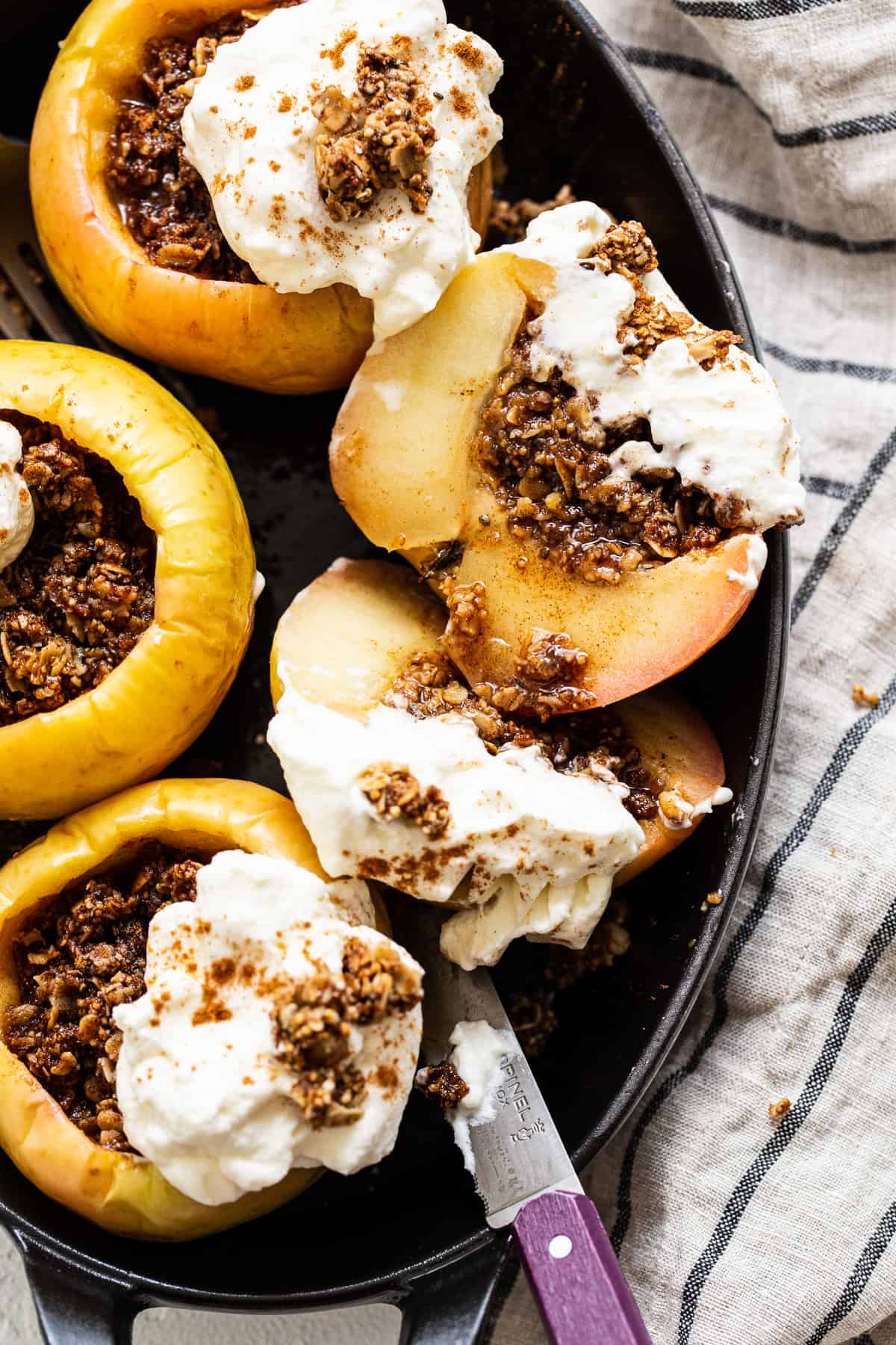 Baked apples topped with whipped cream.