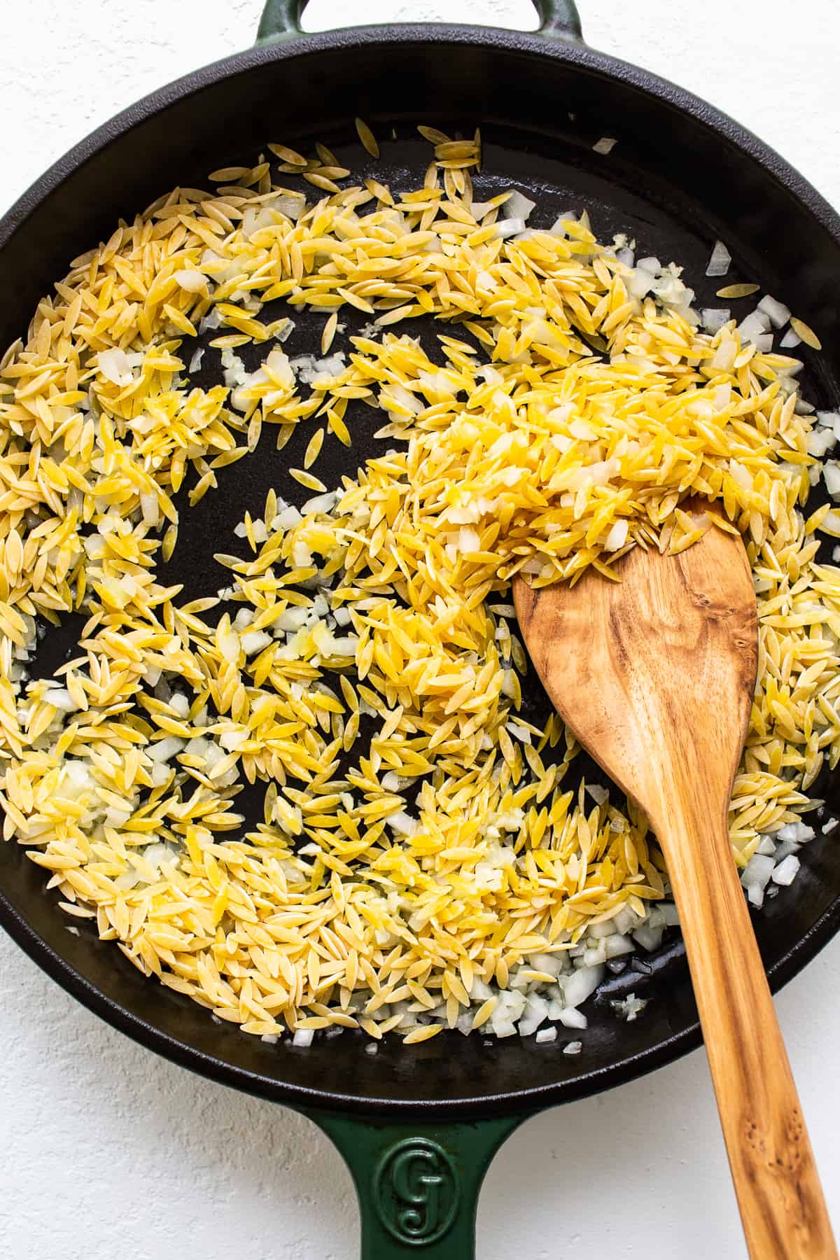 toasting orzo in skillet.