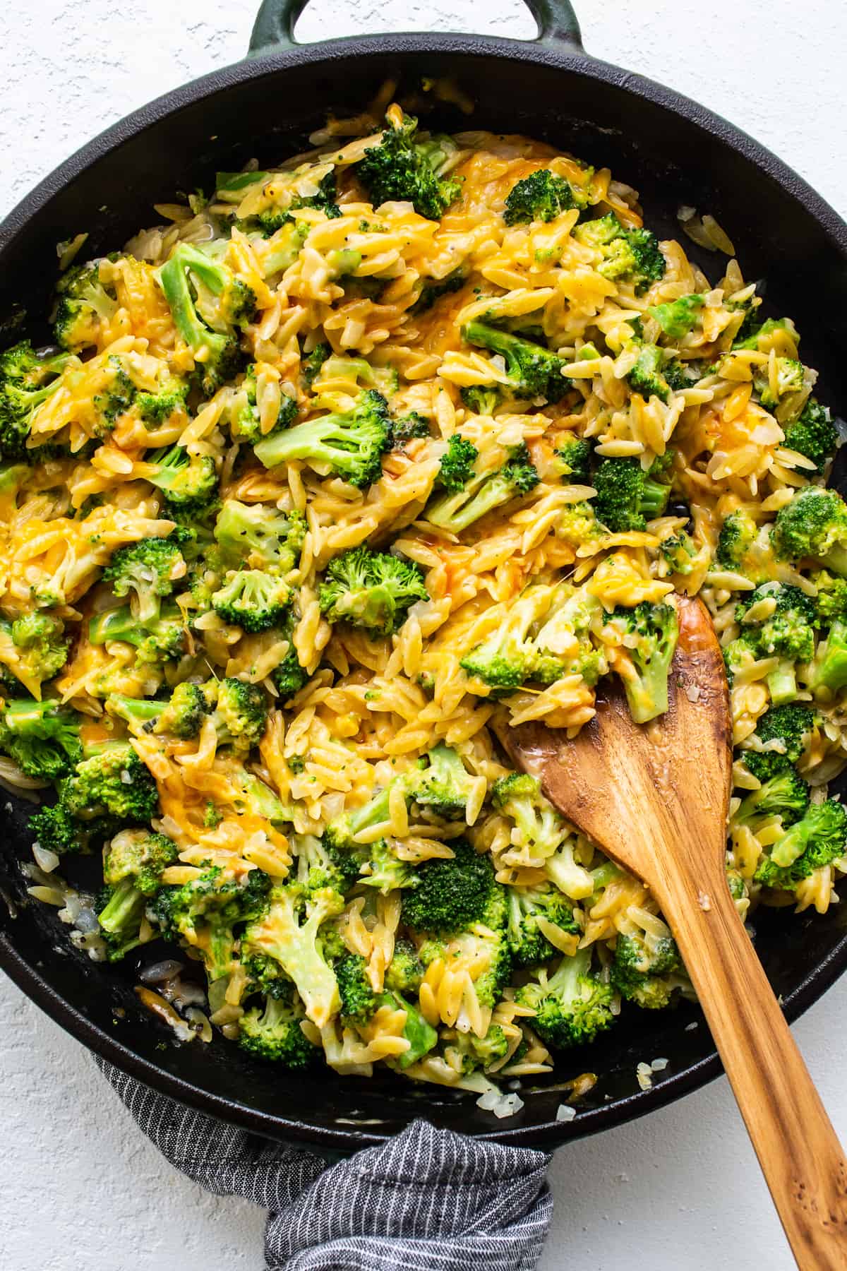 Cheesy broccoli casserole in skillet.