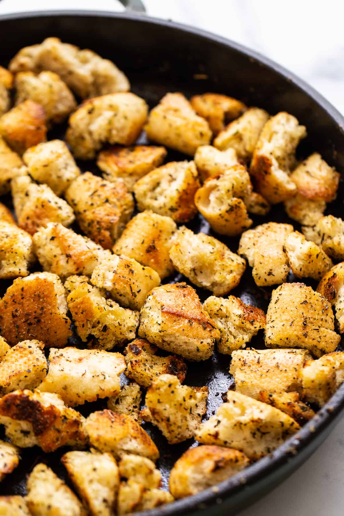 croutons in cast iron skillet.