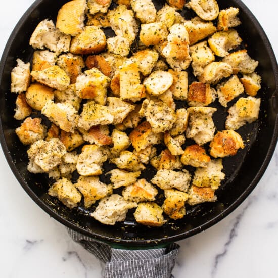 pan frying croutons in cast iron skillet.