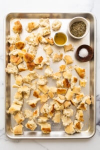 ripped bread on baking sheet.