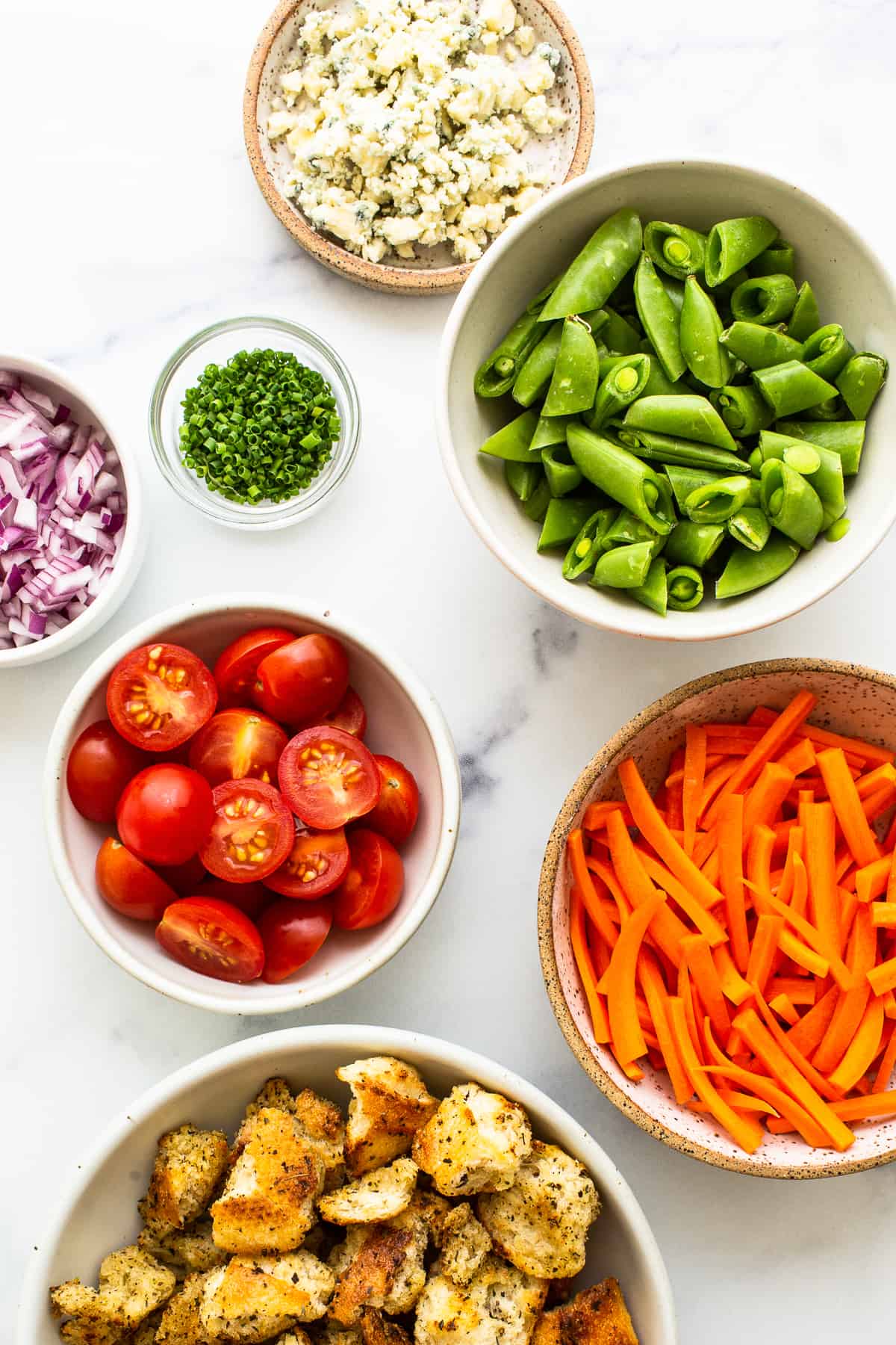 Ingredients for garden salad in bowls.