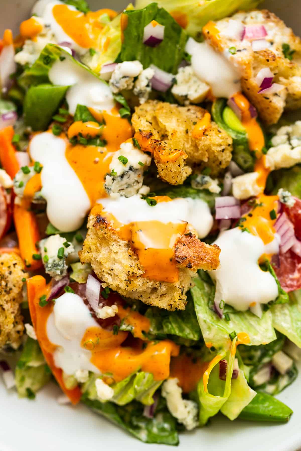 Close up of a homemade crouton in a garden salad.