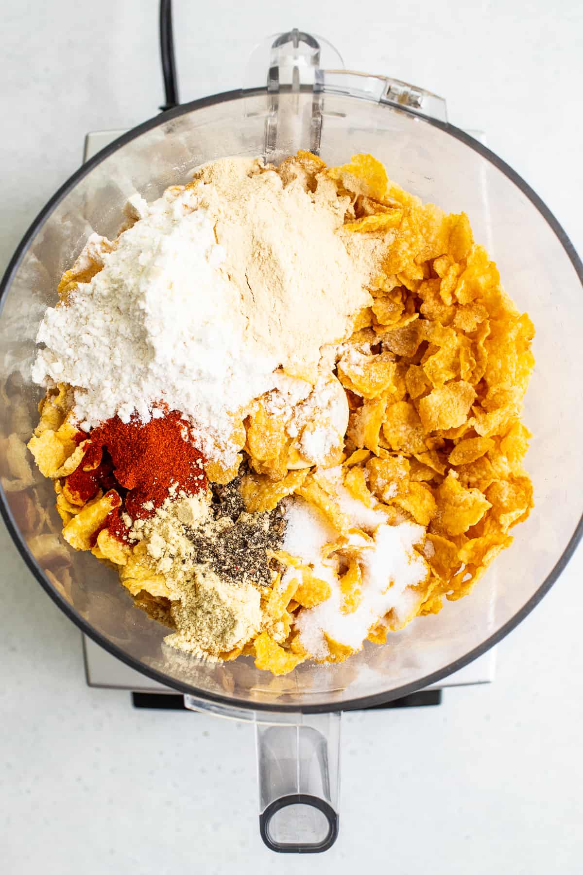 corn flakes and spices in food processor.