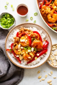 kung pao shrimp with white rice in bowl.